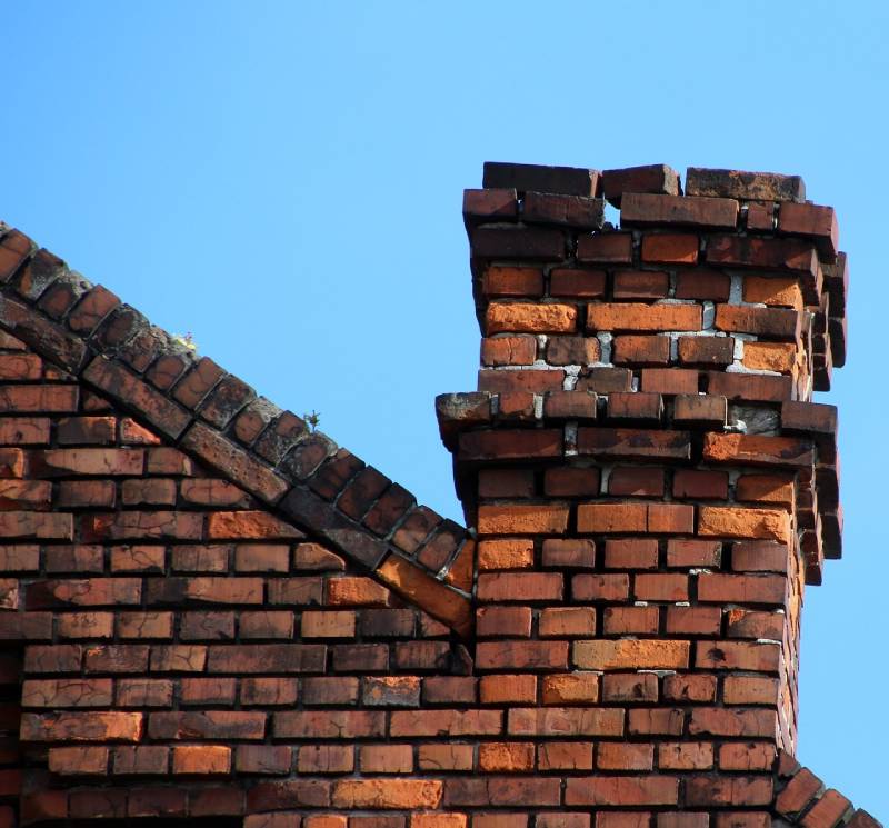 Signs Your Midway City Home Needs a Chimney Inspection Damaged chimney on an Midway City home showing cracks and missing mortar